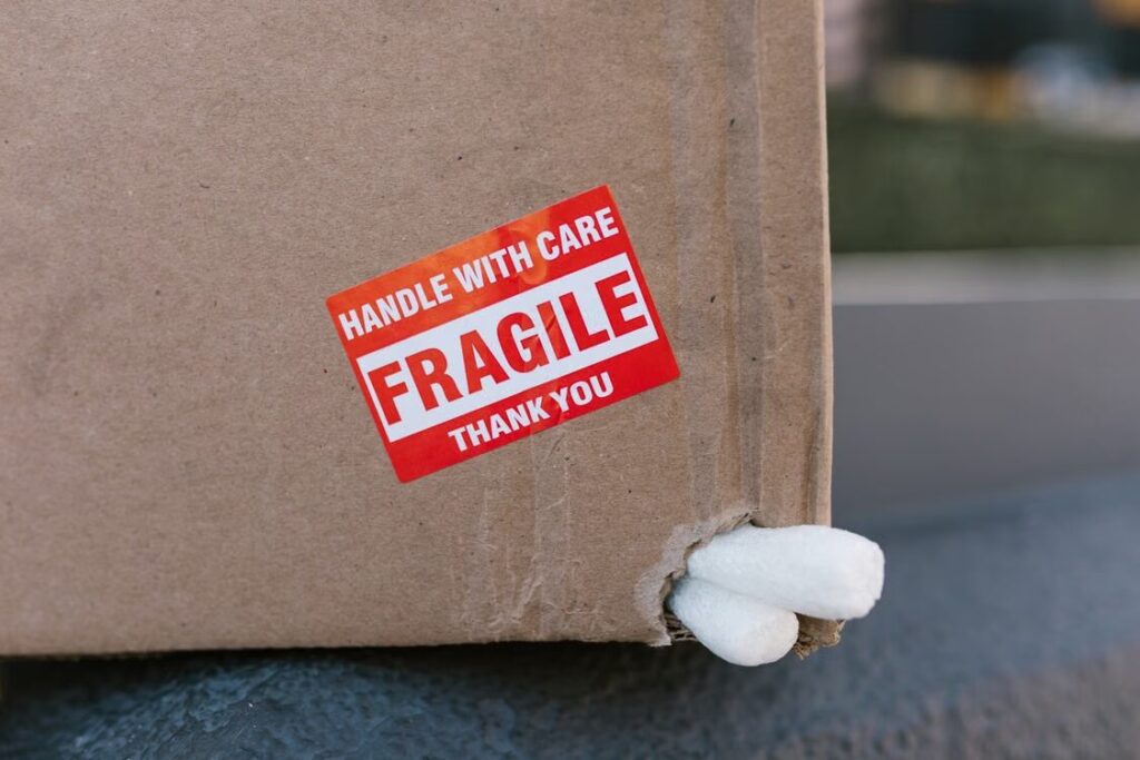 Damaged international shipping box photographed before filing a shipping damage claim.